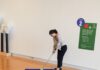 Where to Play Miniature Golf Around Pittsburgh This Summer A woman plays on a blue mini golf course inside the Westmoreland Museum of American Art.