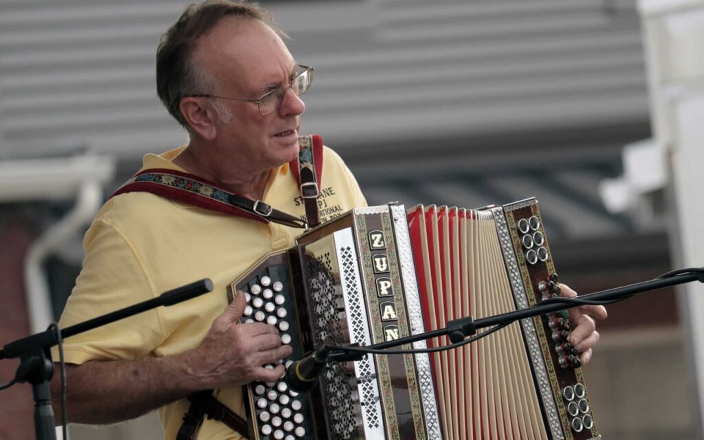 A man playing an accordion.