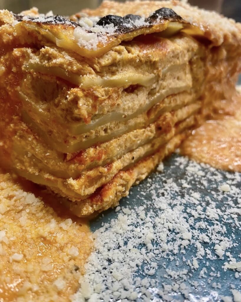A stack of bread with white flake over top.