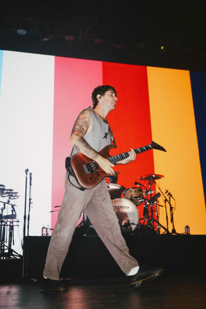 Musician with guitar on stage at Pittsburgh event