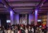 Halloween for Adults: Spooky Fun for Pittsburgh Grown-ups People in costumes at a Halloween party with purple lighting
