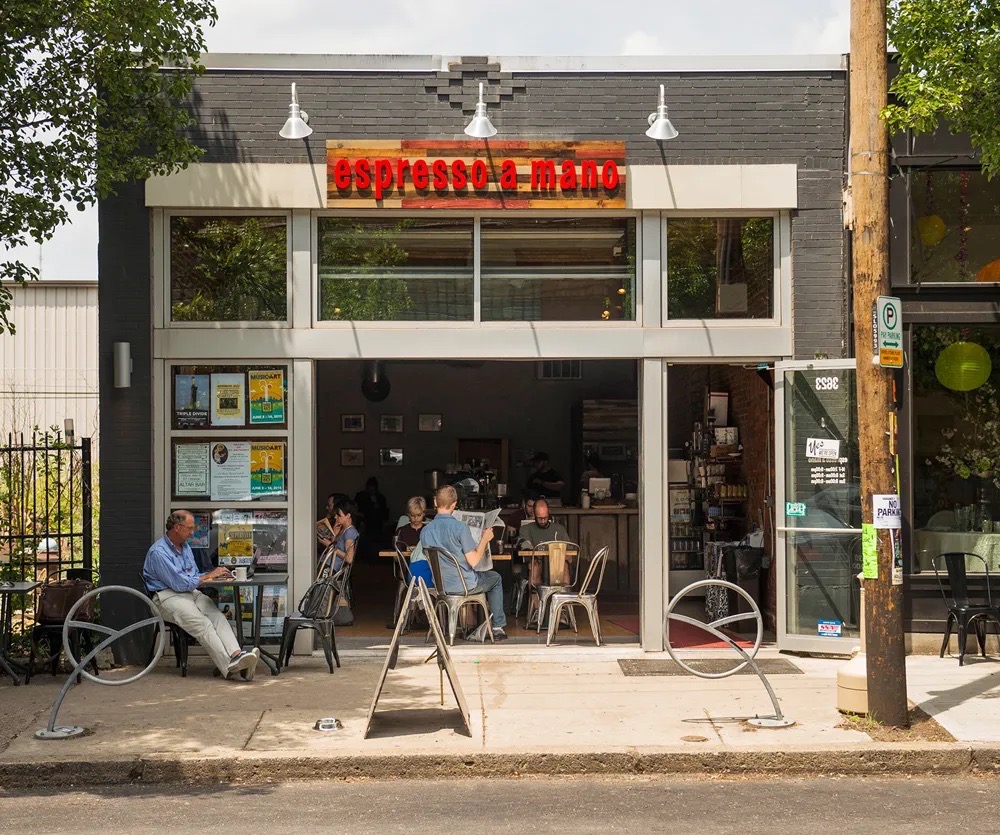 Espresso a Mano cafe in Pittsburgh with outdoor seating and patrons