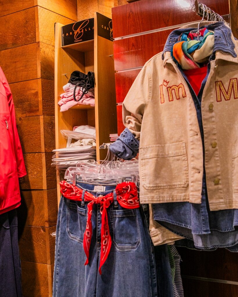 Carabella Oakmont: Denim and tan jacket with "I'm M" text.