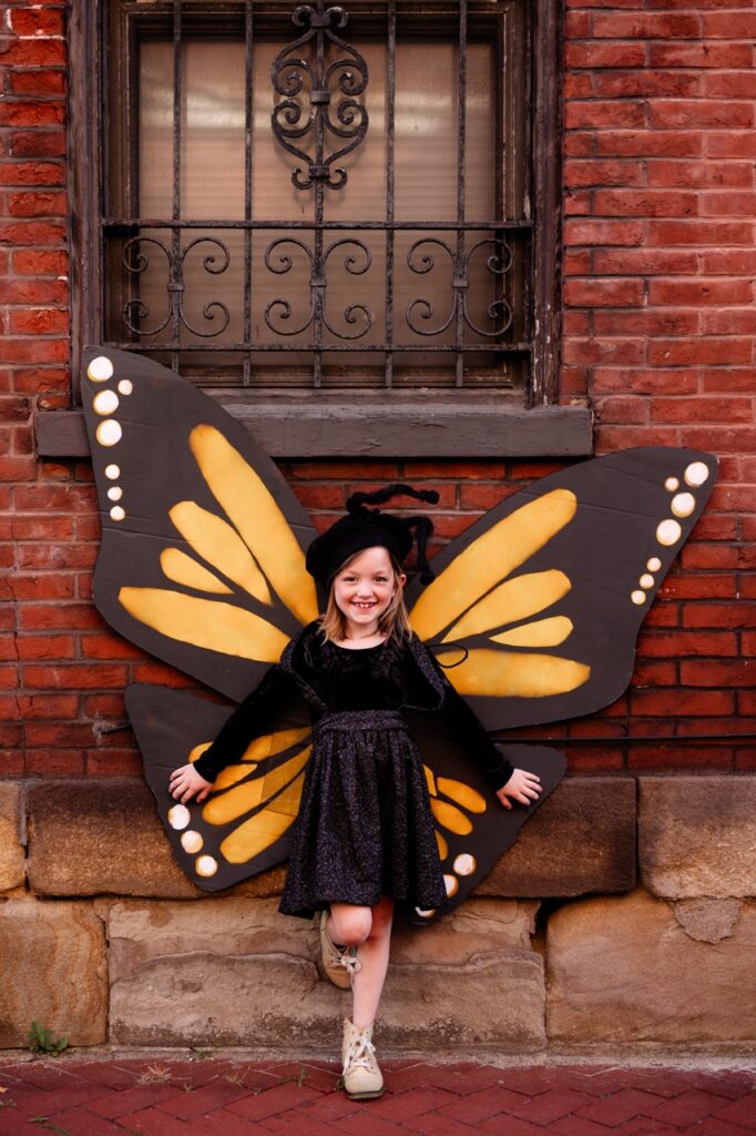 Girl in DIY butterfly halloween costume, a homemade nature costume for kids.