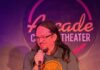 The Best Places to Laugh This Fall at Comedy Shows in Pittsburgh Comedian performs at Arcade Comedy Theater Pittsburgh, wearing a gray t-shirt.