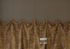 The Hottest Interior Design Trends for 2027: More Pattern, More Personality, More Craft, More Everything Ornate daybed with patterned cushions in a room with bold, patterned drapery.