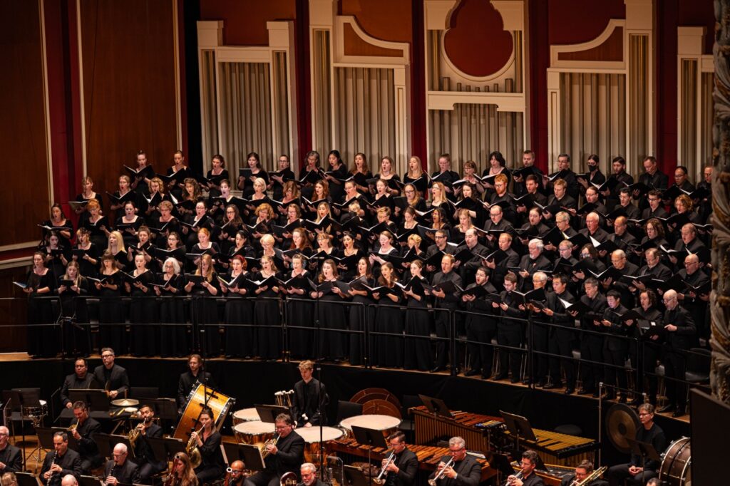 Mendelssohn Choir of Pittsburgh performs in a grand concert hall with organ