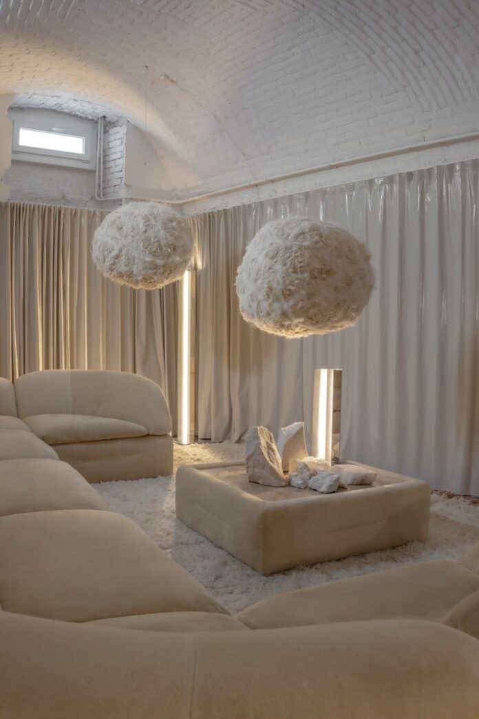 Plush cream sofa and fluffy pendant lights in a modern living room