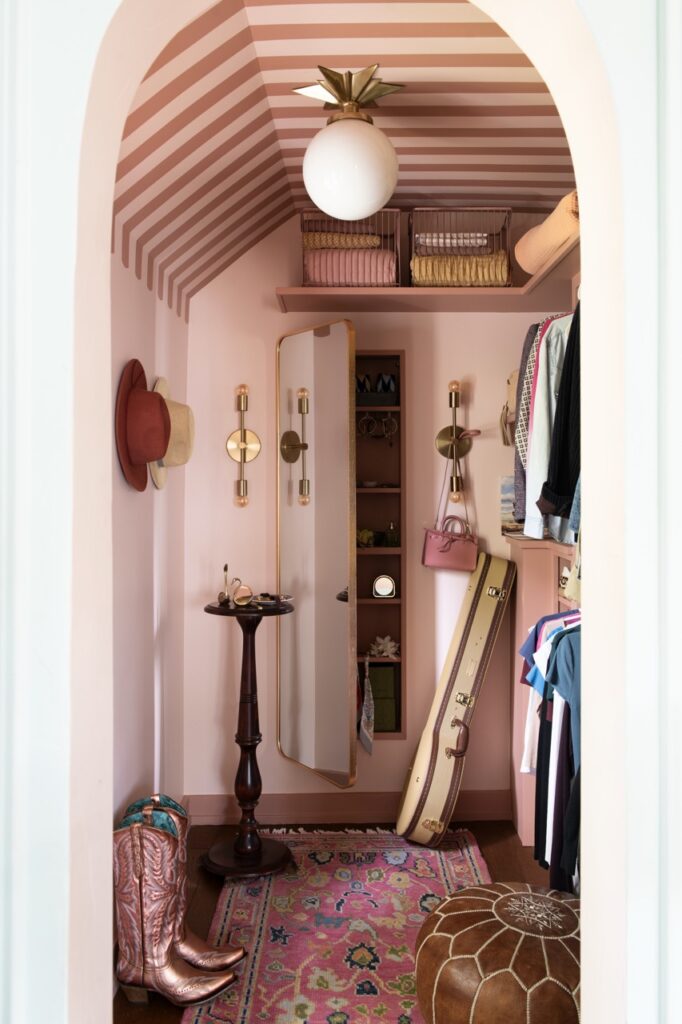 Pink fairy tale cottage closet with cowboy boots and hats