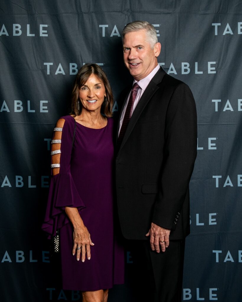 Couple poses at a TABLE event
