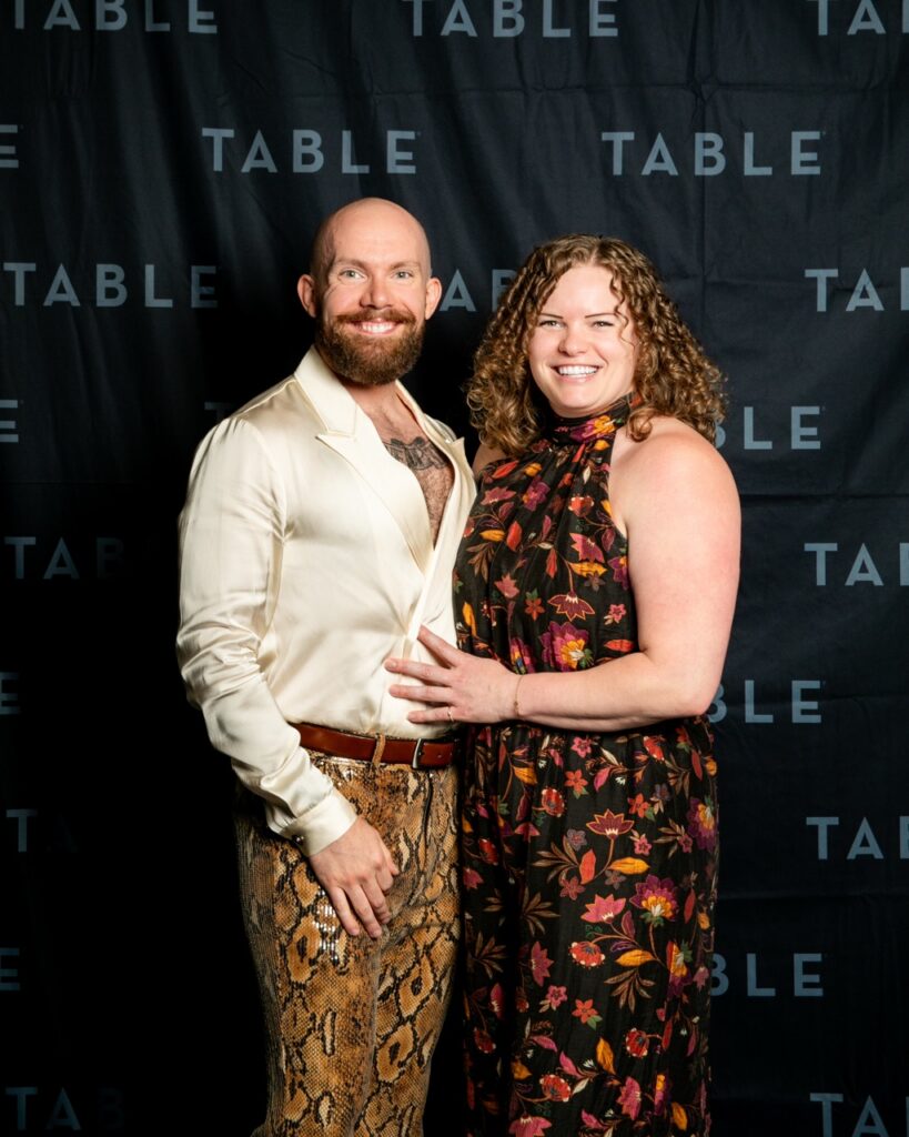 Couple posing for photo at TABLE event