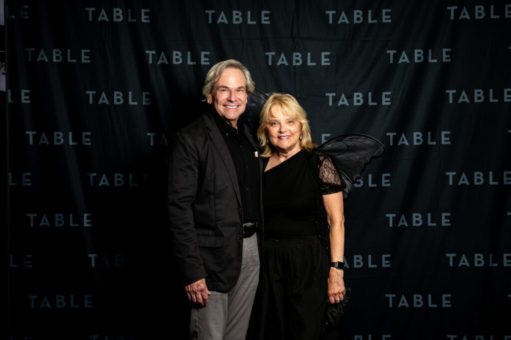 Couple posing for a photo at a TABLE event