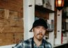Peter Henry Is the New Chef at Pittsburgh’s Scratch & Co. Peter Henry, chef at Pittsburgh's Scratch & Co., wearing a plaid shirt and apron.