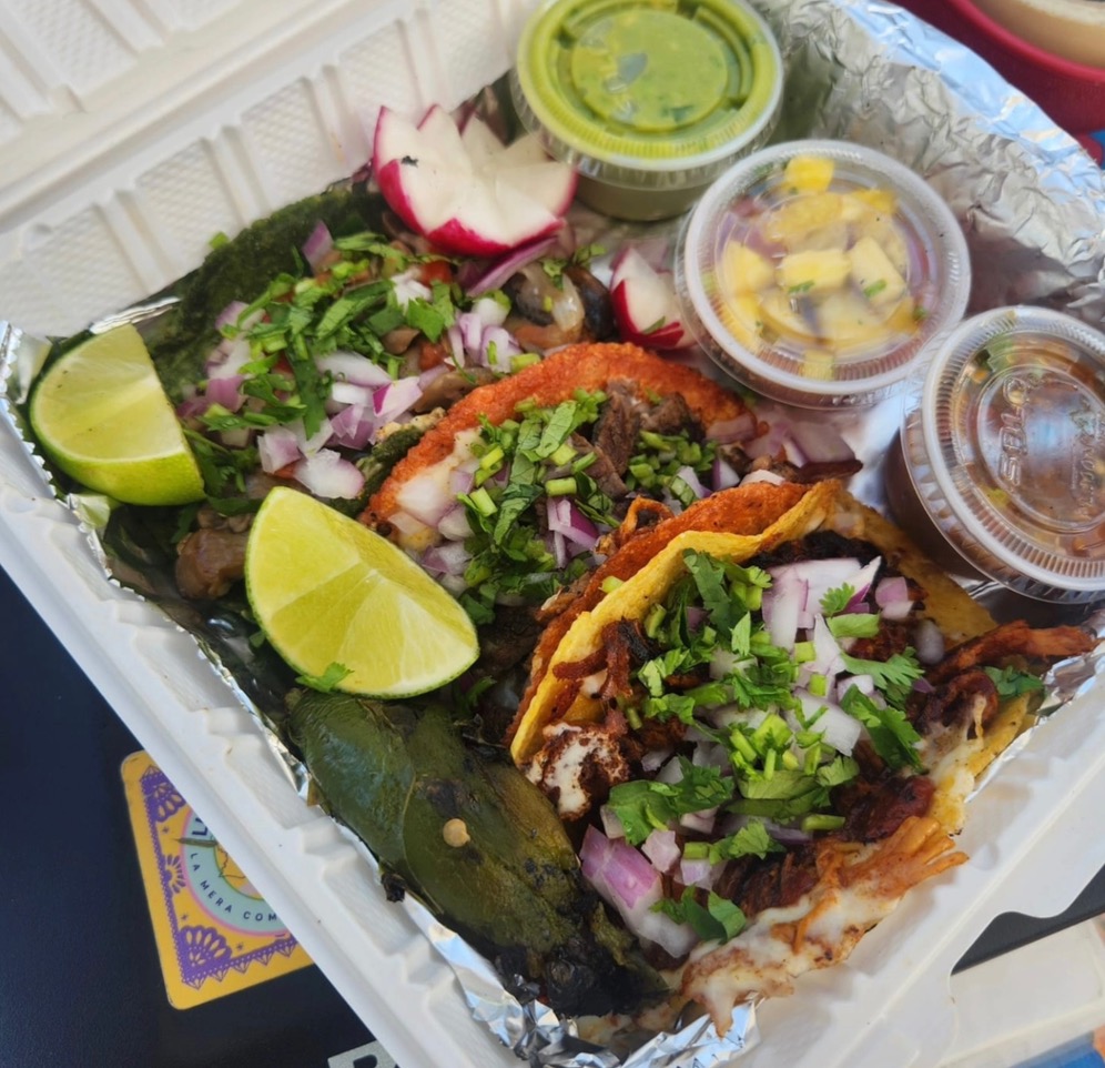 Tacos with toppings and salsas from Lulá La Chula restaurant in Pittsburgh.