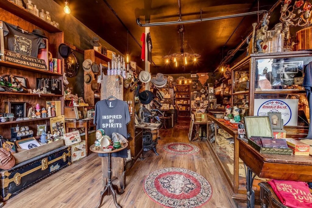 Interior of a unique Pittsburgh shop filled with vintage items, hats, and curiosities.