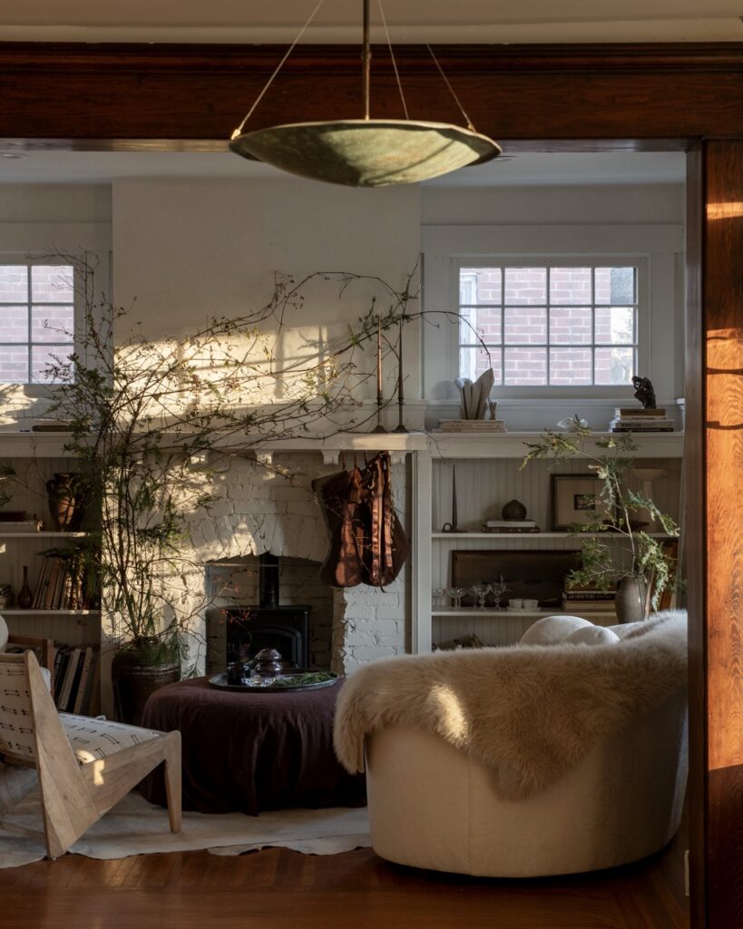 Erin Kelly's living room with foraged holiday decor, natural elements, and warm sunlight.