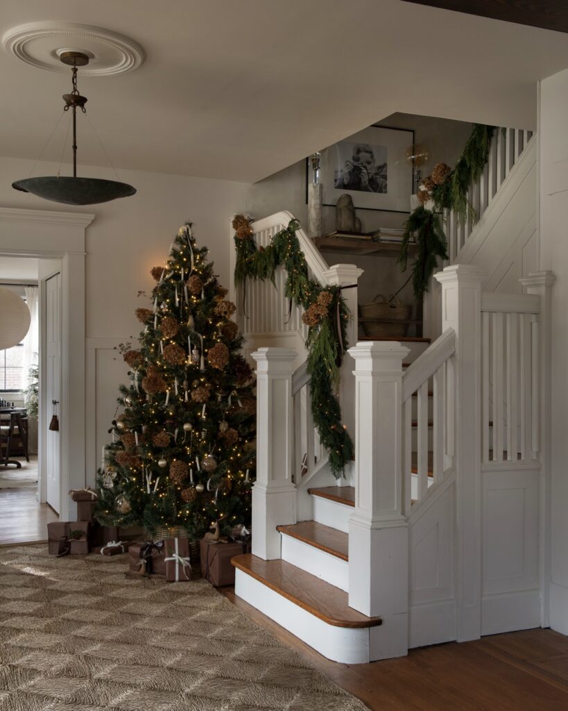 Foraged holiday decor: Christmas tree and garland in a home by photographer Erin Kelly