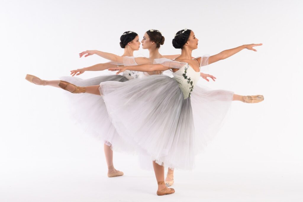 Pittsburgh Ballet Theatre dancers in Giselle costumes performing a graceful pose.