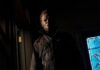 The 10 Best Horror Movies You Can Watch in Pittsburgh Movie Theaters This October Michael Myers in a dark hallway holding a knife, a horror movie icon.