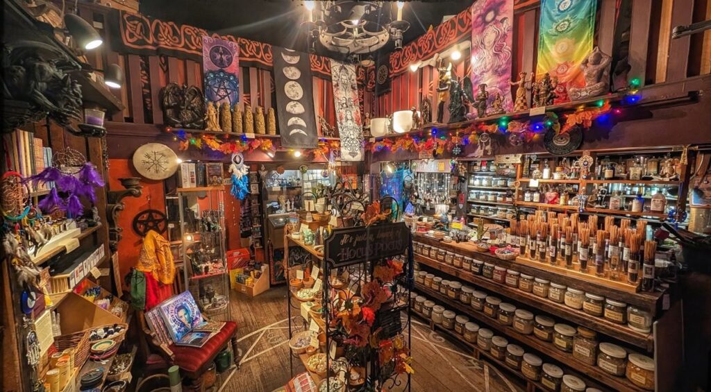 Goth shop interior in Pittsburgh with shelves of incense, jars, and mystical decor.