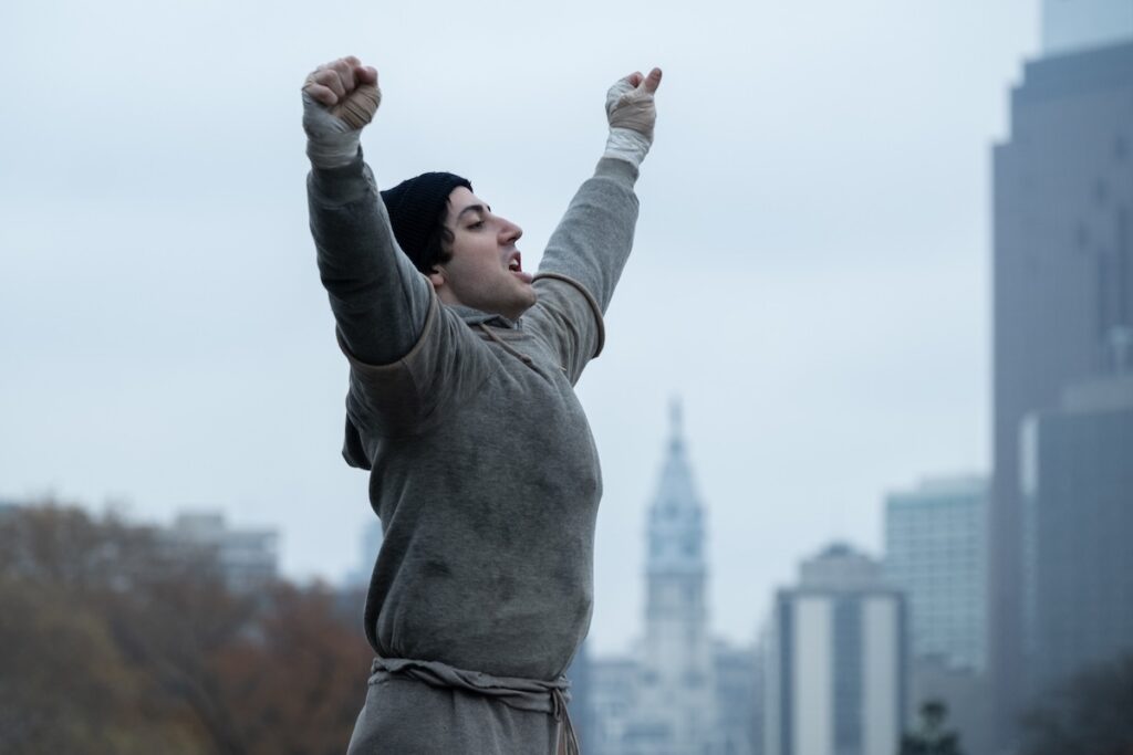 Rocky Balboa celebrates a victory in Pittsburgh, embodying the spirit of the Three Rivers Film Festival.
