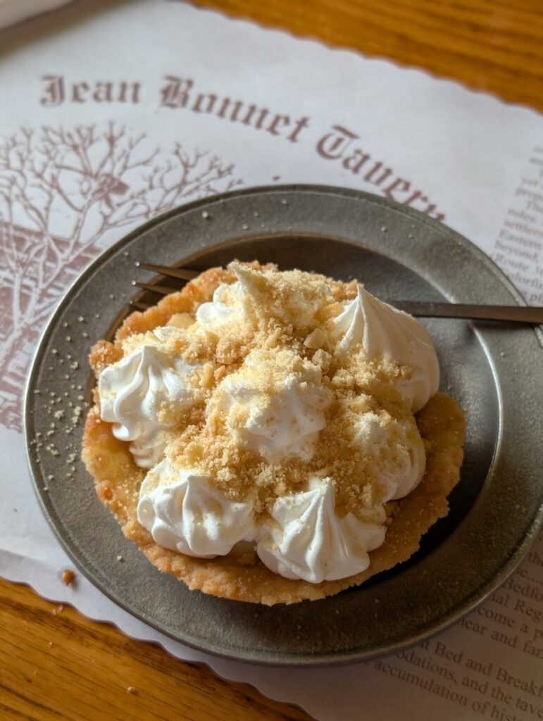Jean Bonnet Tavern dessert: a small tart topped with whipped cream and crumble