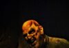 Your Guide to Portals of Fear Haunted Attraction: Tickets, VIP Experience & What to Expect Scary clown with bloodied hands at Portals of Fear haunted attraction