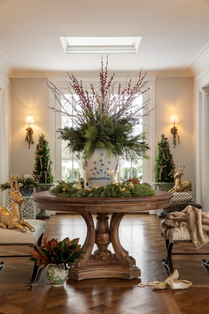 Luxurious holiday entry with festive floral decor and reindeer accents.