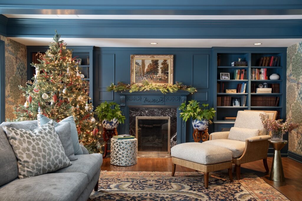 Luxurious holiday living room with decorated Christmas tree and fireplace by Shelley McIlroy Design