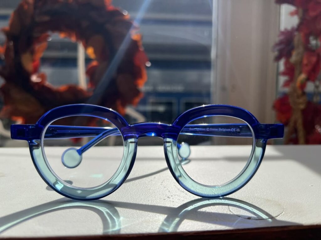 Blue and teal round eyeglasses from HeidiOptics, showcasing personal style.