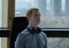 Collier’s Cuts: In ‘The Social Reckoning,’ Aaron Sorkin Revisits Facebook, Where Things Have Gotten Worse Jeremy Strong sits in an office chair as Mark Zuckerberg with headphones around his neck and a laptop in front of him.